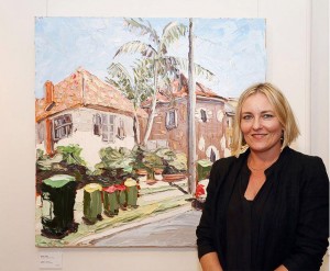 Sally West with her art work on opening night