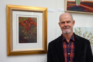 Artist Greg Jarmaine with his work  "Roses"  Oil on Canvas (34x24cm)