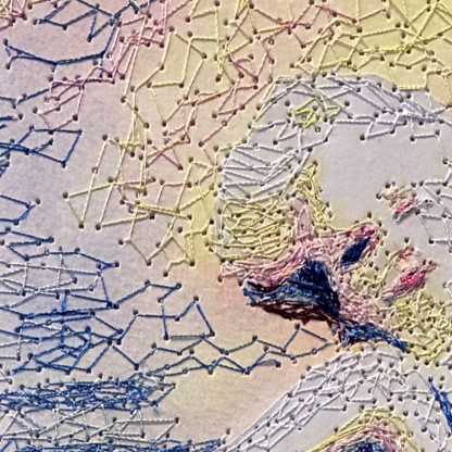 Close-up of a face stitched in blue, pink and cream thread, with the needle holes visible in the paper